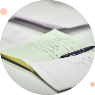 This image shows a note book and pen.