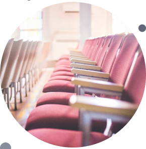 This image shows a row of empty lecture hall seats.