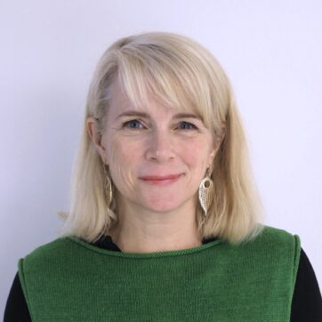 This image shows a profile view of Clare Dobson with an off white background.