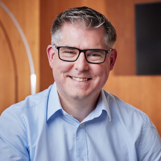 Headshot of Chris Hewson