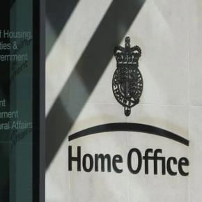 This image shows the Home Office crest next to a building entrance