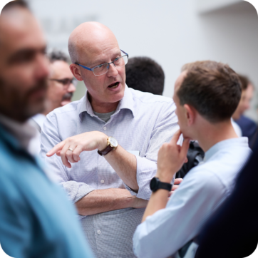 This image shows two people talking